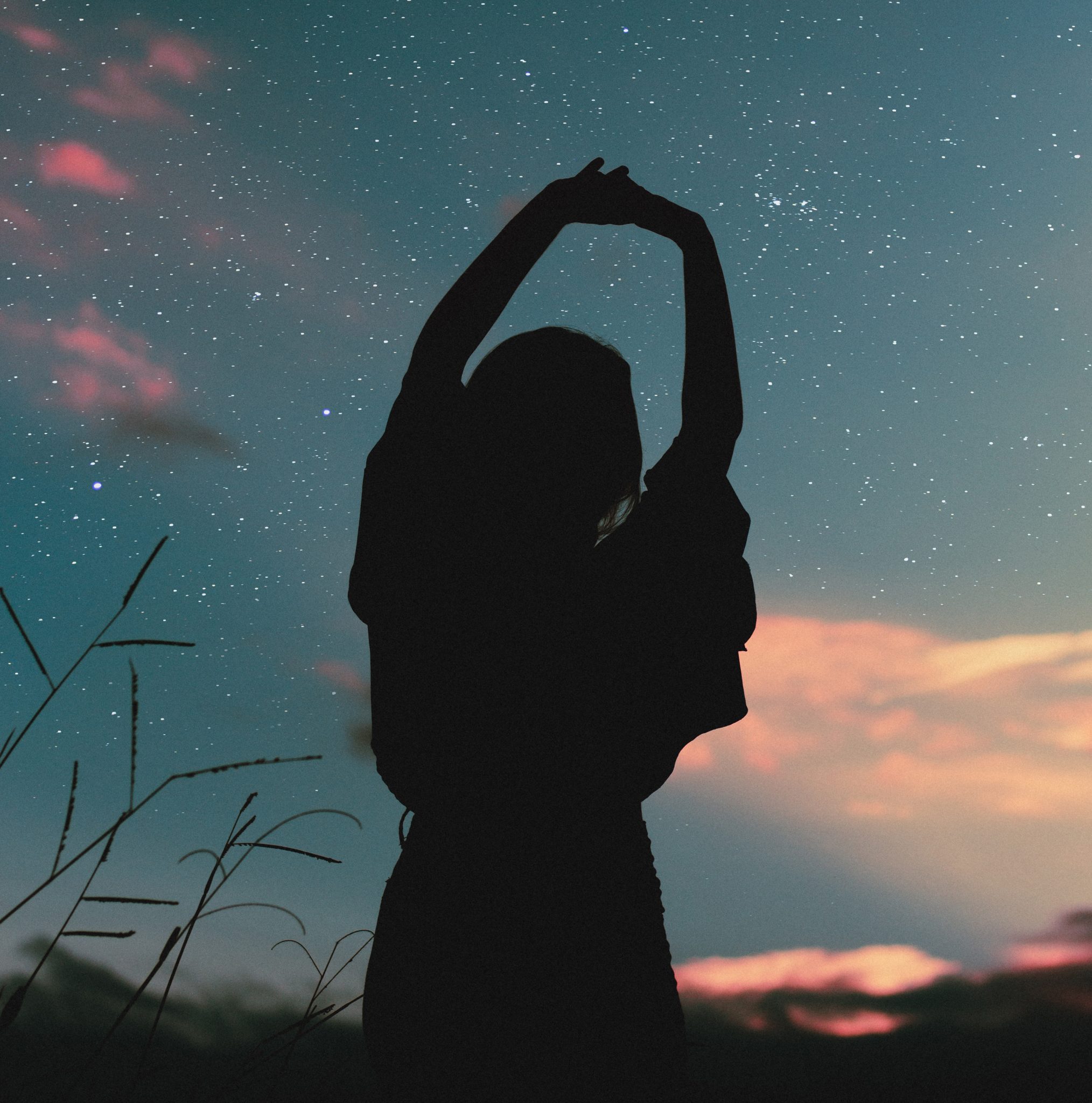 woman dancing at sunset