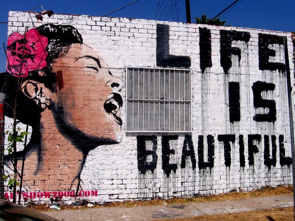 Woman pictured on a white wall