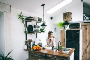 woman drinking tea in kitchen