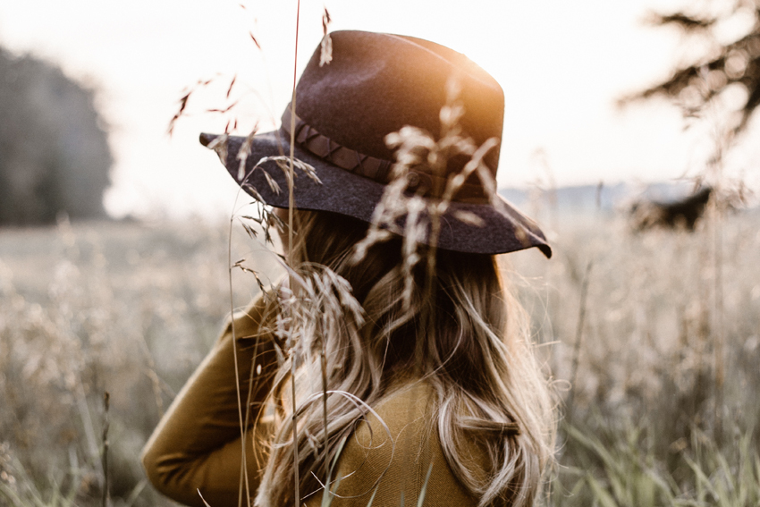 Excuses Equals No Progress | Woman looking out onto a field